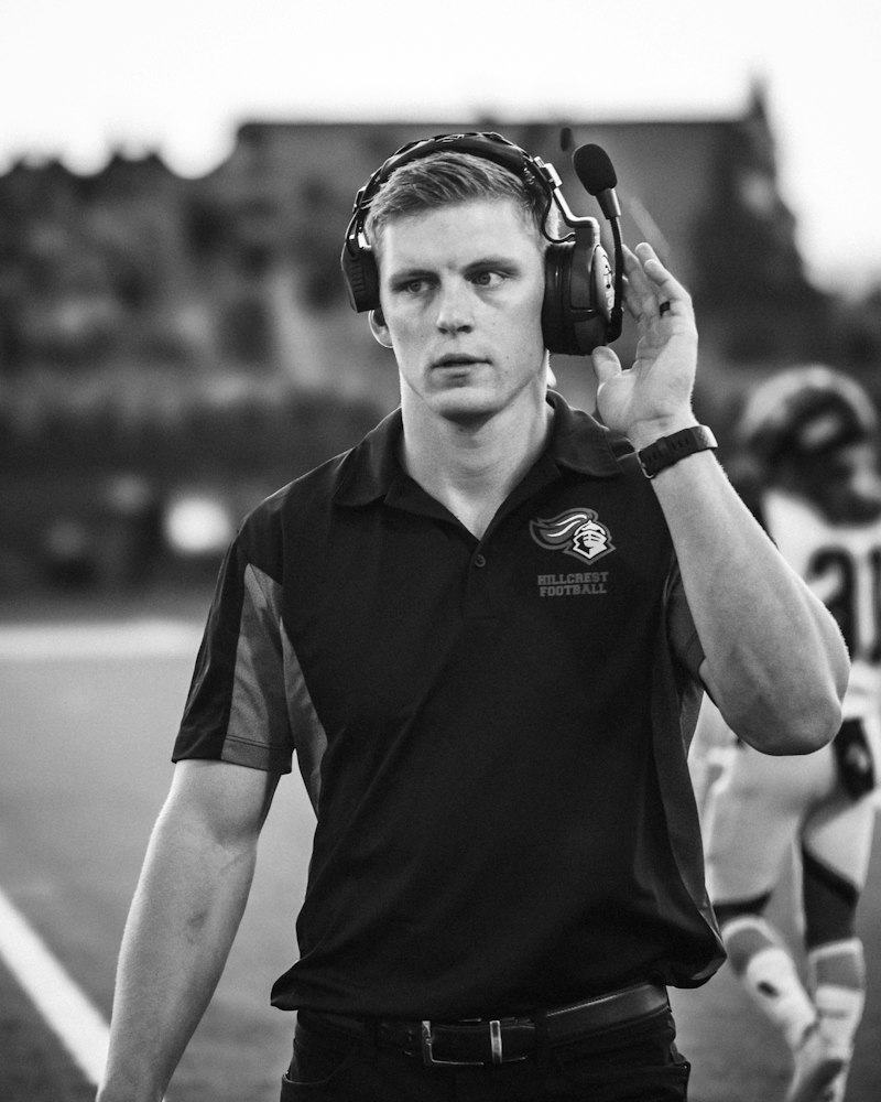 Football coach on sideline with headset